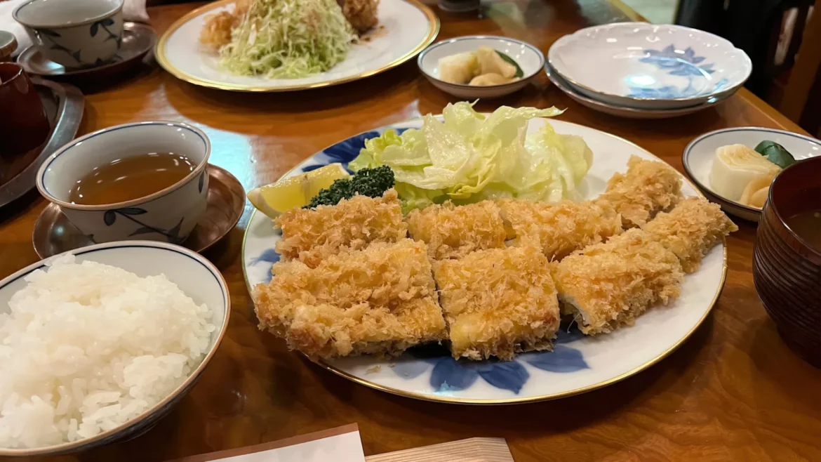 Image of Pon-to Honten, a historic tonkatsu restaurant in Ueno, Tokyo, with delicious dishes and an audio menu feature.