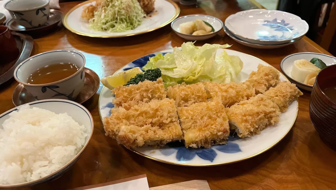 Image of Pon-to Honten, a historic tonkatsu restaurant in Ueno, Tokyo, with delicious dishes and an audio menu feature.